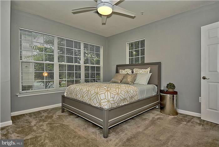 11349 King George Drive, Unit 10 Silver Spring, MD 20902 - Photo 11 of 20 a bed sitting in a room next to a window