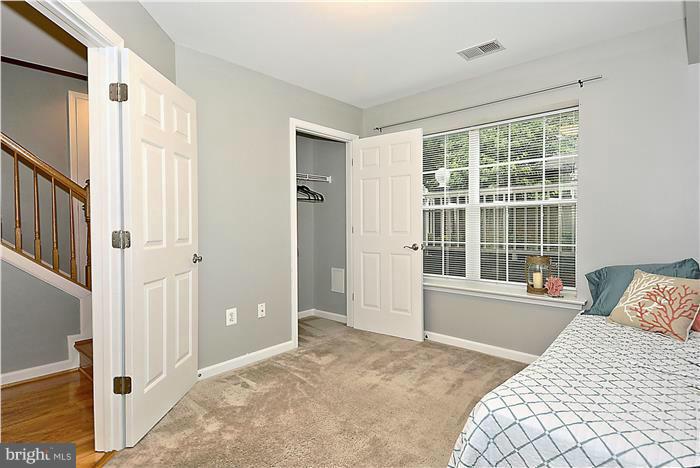 11349 King George Drive, Unit 10 Silver Spring, MD 20902 - Photo 15 of 20 a bedroom with a bed and a large window