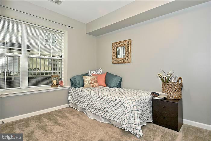 11349 King George Drive, Unit 10 Silver Spring, MD 20902 - Photo 16 of 20 a bedroom with a bed and a window