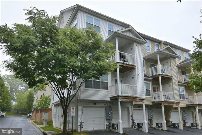 11349 King George Drive, Unit 10 Silver Spring, MD 20902 - Photo 3 of 20 a front view of a house with balcony