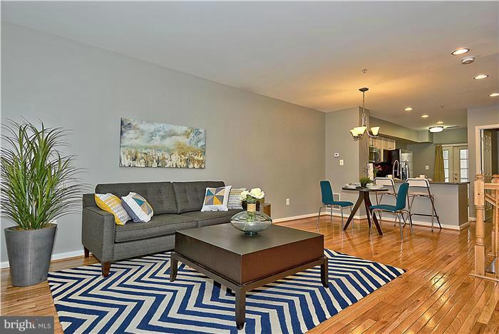 11349 King George Drive, Unit 10 Silver Spring, MD 20902 - Photo 5 of 20 a living room with furniture and a breakfast area