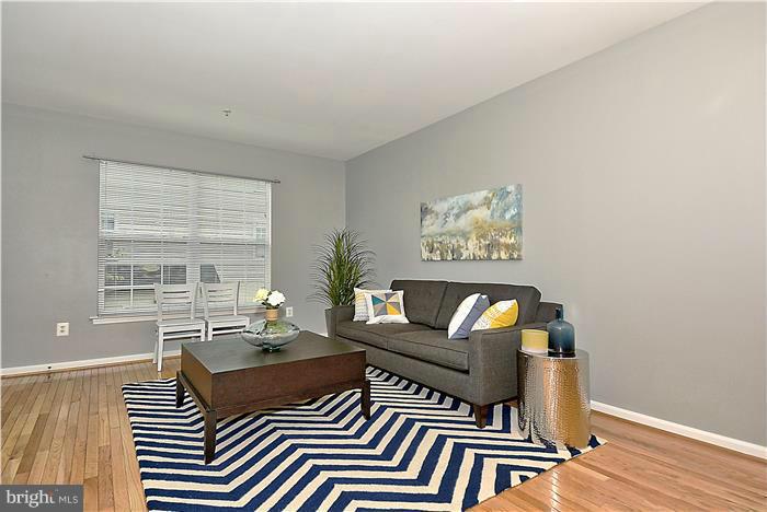 11349 King George Drive, Unit 10 Silver Spring, MD 20902 - Photo 6 of 20 a living room with furniture and a window