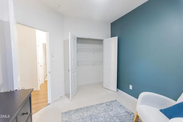 a bathroom with a toilet a sink and a mirror