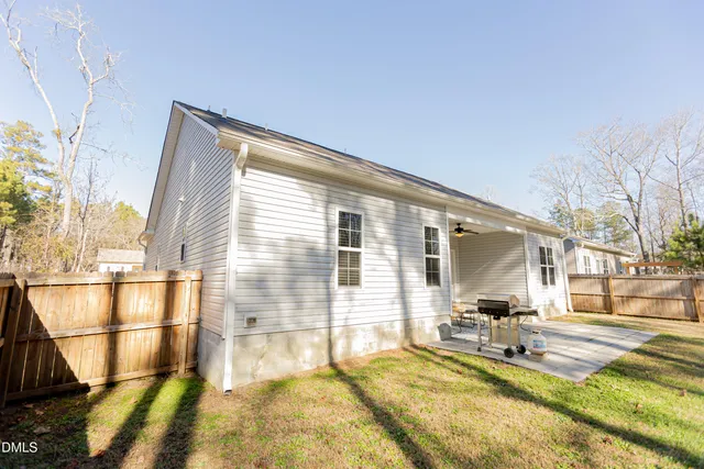 a view of a swimming pool with an outdoor space and seating area