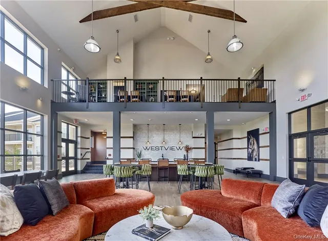 a dining room with furniture and window