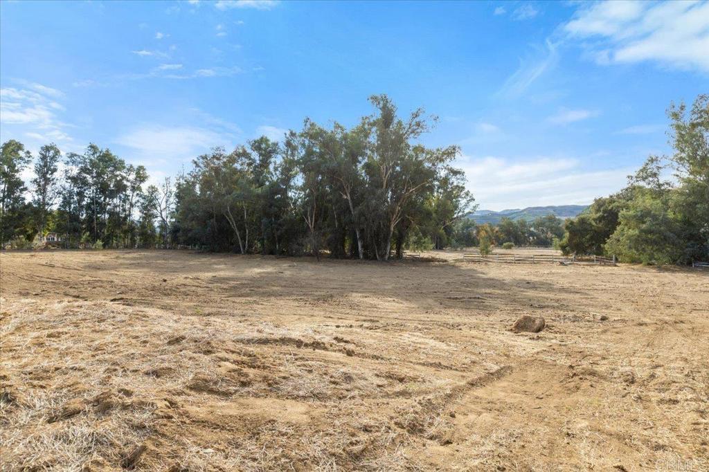 34174 Hampton Road Pauma Valley, CA 92061 - Photo 16 of 20 a view of dirt field with trees in background