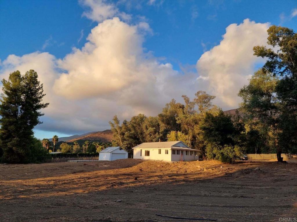 34174 Hampton Road Pauma Valley, CA 92061 - Photo 2 of 20 a front view of a house with a yard and garage