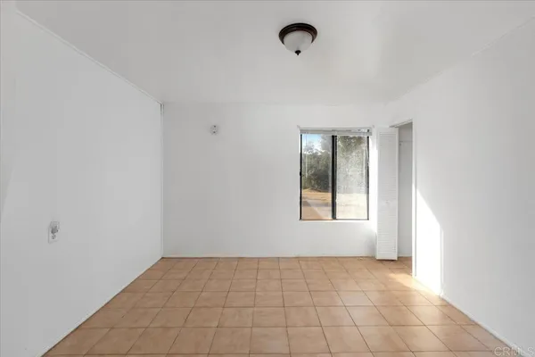 a view of an empty room and window