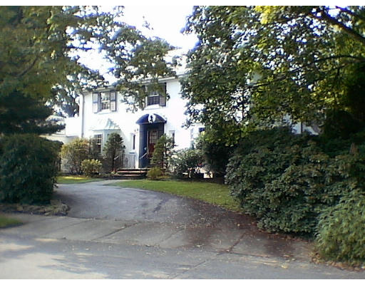 50 Quincy Road Newton, MA 02467 - Photo 1 of 7 a front view of a house with garden