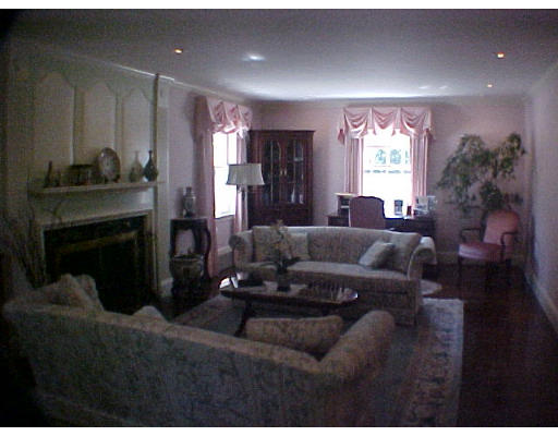 50 Quincy Road Newton, MA 02467 - Photo 2 of 7 a living room with furniture and a fireplace