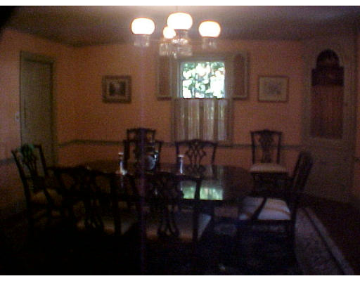 50 Quincy Road Newton, MA 02467 - Photo 4 of 7 a view of a dining room with furniture and chandelier