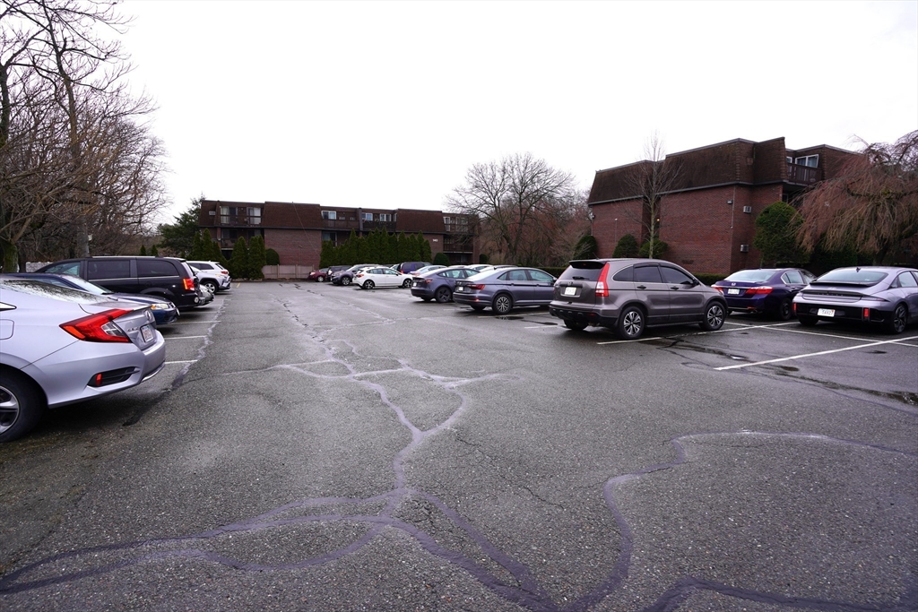 140 Kenrick Street, Unit 8 Boston, MA 02135 - Photo 13 of 16 a view of street with parked cars