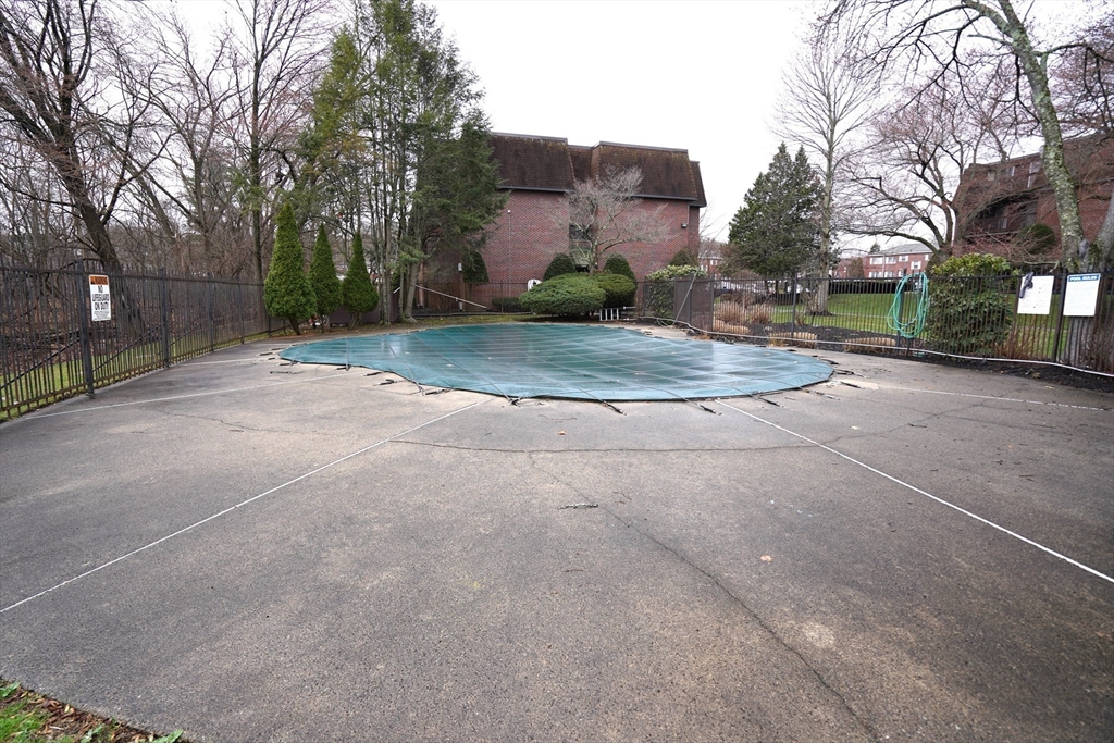 140 Kenrick Street, Unit 8 Boston, MA 02135 - Photo 14 of 16 a view of a house with a street