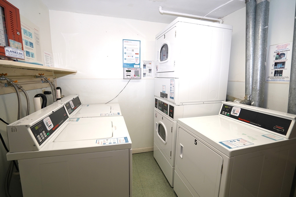 140 Kenrick Street, Unit 8 Boston, MA 02135 - Photo 10 of 16 a utility room with dryer and washer