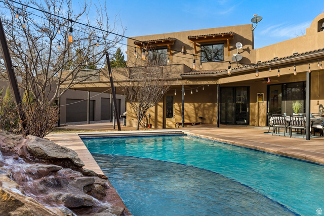 98 Bridge Road Rockville, UT 84763 - Photo 53 of 75 Back of property with a patio area, stucco siding, an outdoor pool, and outdoor dining area