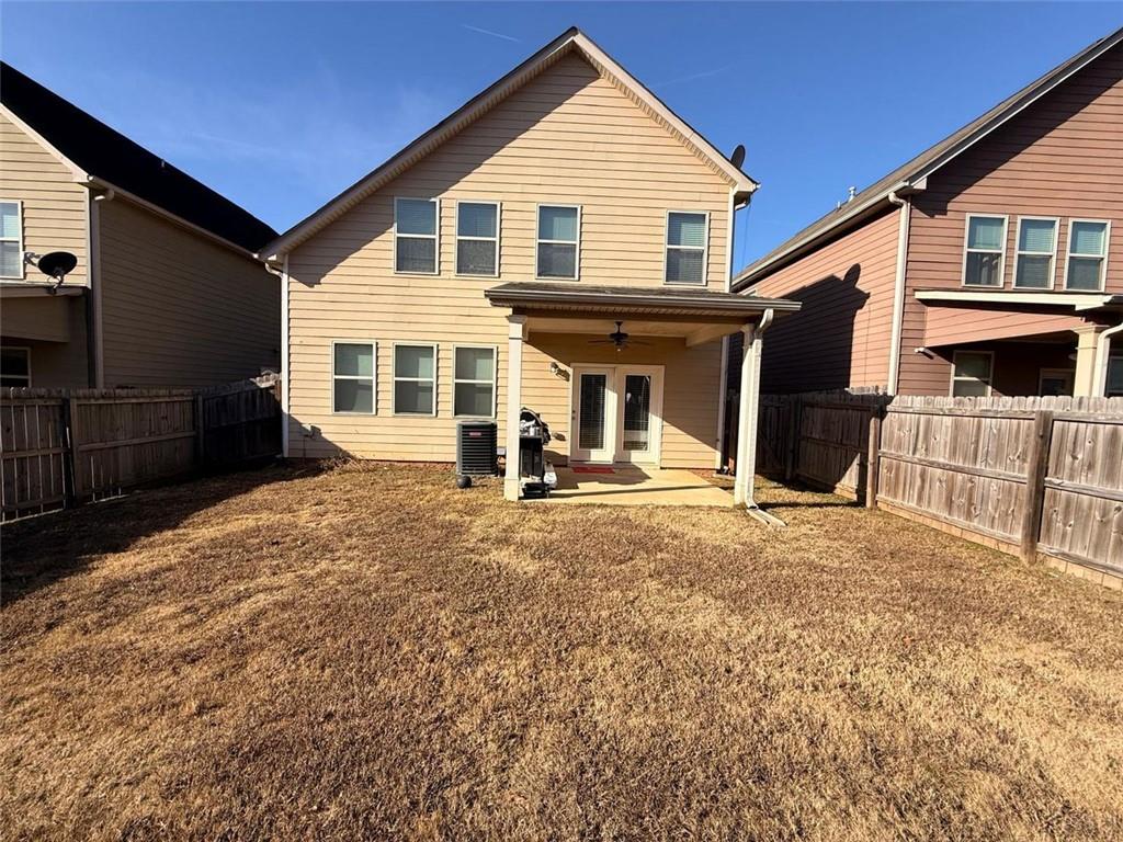 2450 Oakleaf Circle Lithonia, GA 30058 - Photo 19 of 40 a front view of a house with a yard