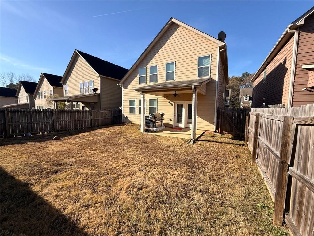 2450 Oakleaf Circle Lithonia, GA 30058 - Photo 20 of 40 a view of a house with wooden fence