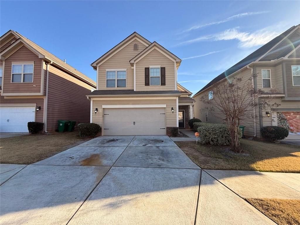 2450 Oakleaf Circle Lithonia, GA 30058 - Photo 2 of 40 a view of garage yard and front view of a house