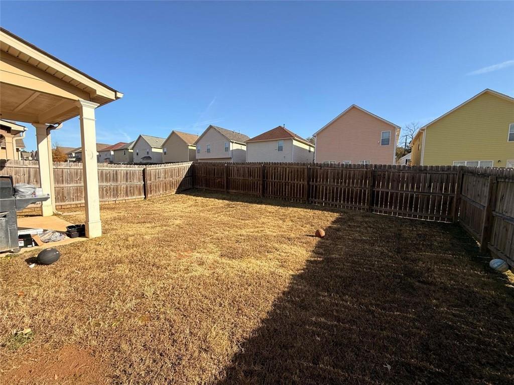 2450 Oakleaf Circle Lithonia, GA 30058 - Photo 21 of 40 a view of a house with backyard and sitting area