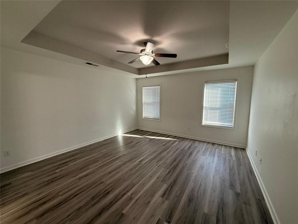 2450 Oakleaf Circle Lithonia, GA 30058 - Photo 28 of 40 wooden floor in an empty room with a window