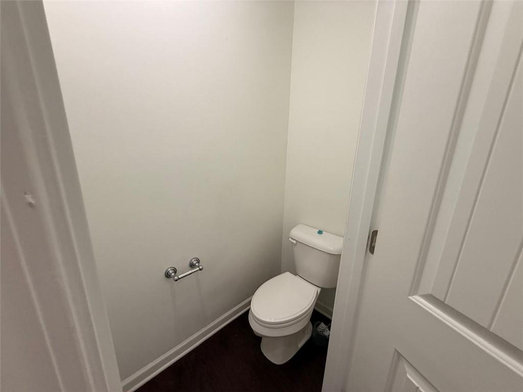 2450 Oakleaf Circle Lithonia, GA 30058 - Photo 31 of 40 a white toilet sitting next to a small sink