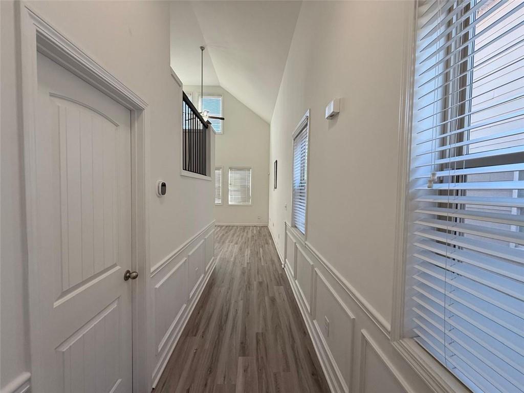 2450 Oakleaf Circle Lithonia, GA 30058 - Photo 6 of 40 a view of a hallway with wooden floor and staircase