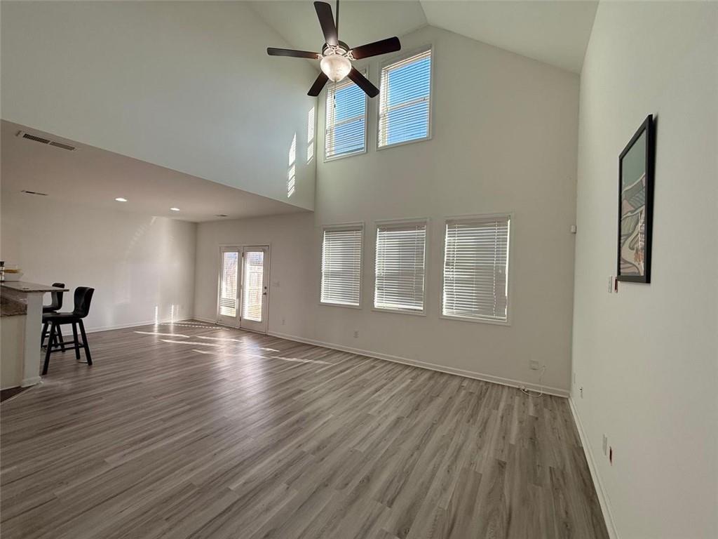 2450 Oakleaf Circle Lithonia, GA 30058 - Photo 9 of 40 a view of empty room with wooden floor and fan