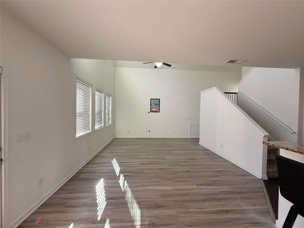 2450 Oakleaf Circle Lithonia, GA 30058 - Photo 10 of 40 a view of a livingroom with wooden floor and staircase