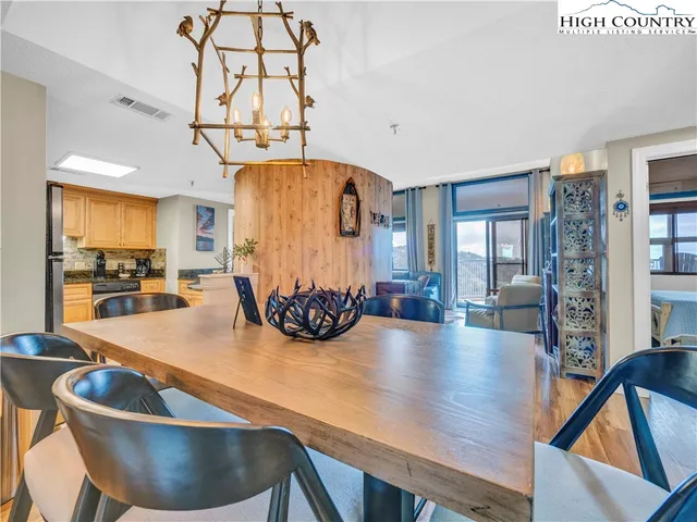 a kitchen with a table and chairs