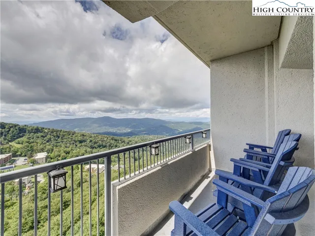 a view of balcony with furniture