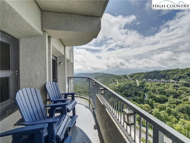 a view of balcony with furniture