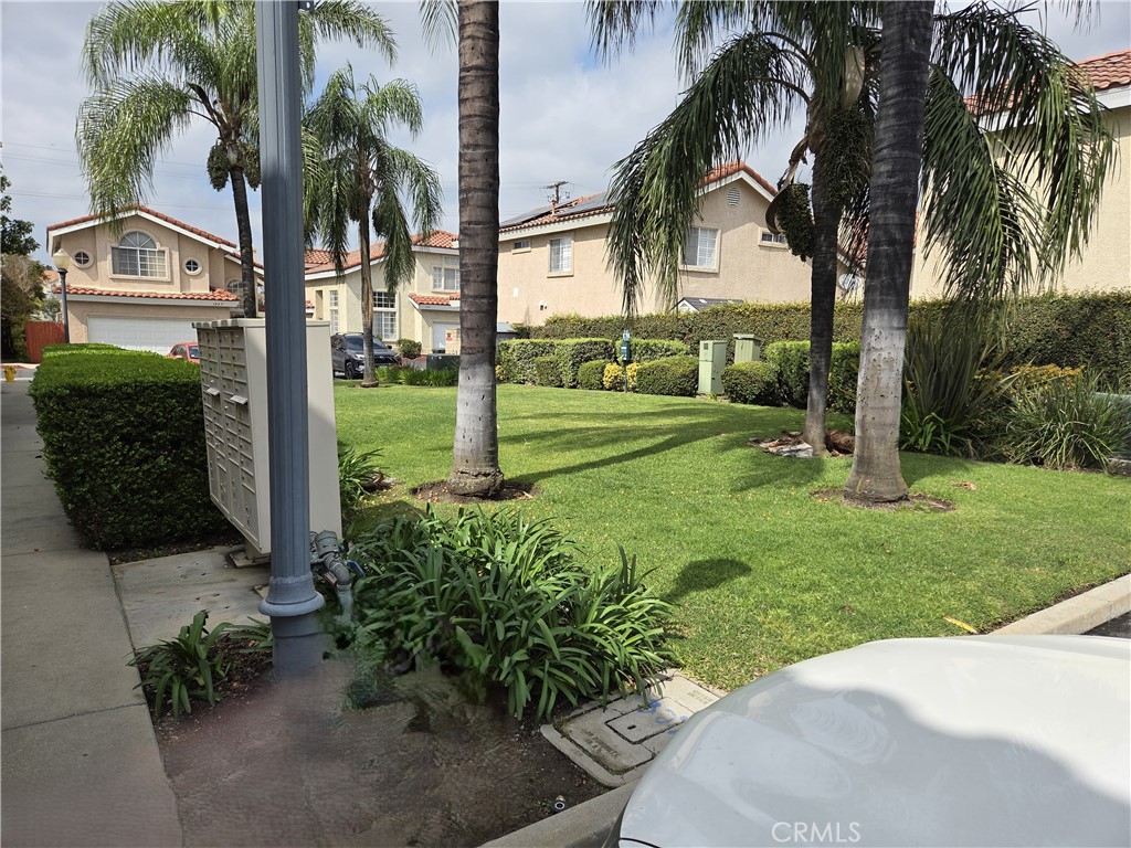1330 Meadow Lane Duarte, CA 91010 - Photo 15 of 15 front view of a house with a yard and palm trees