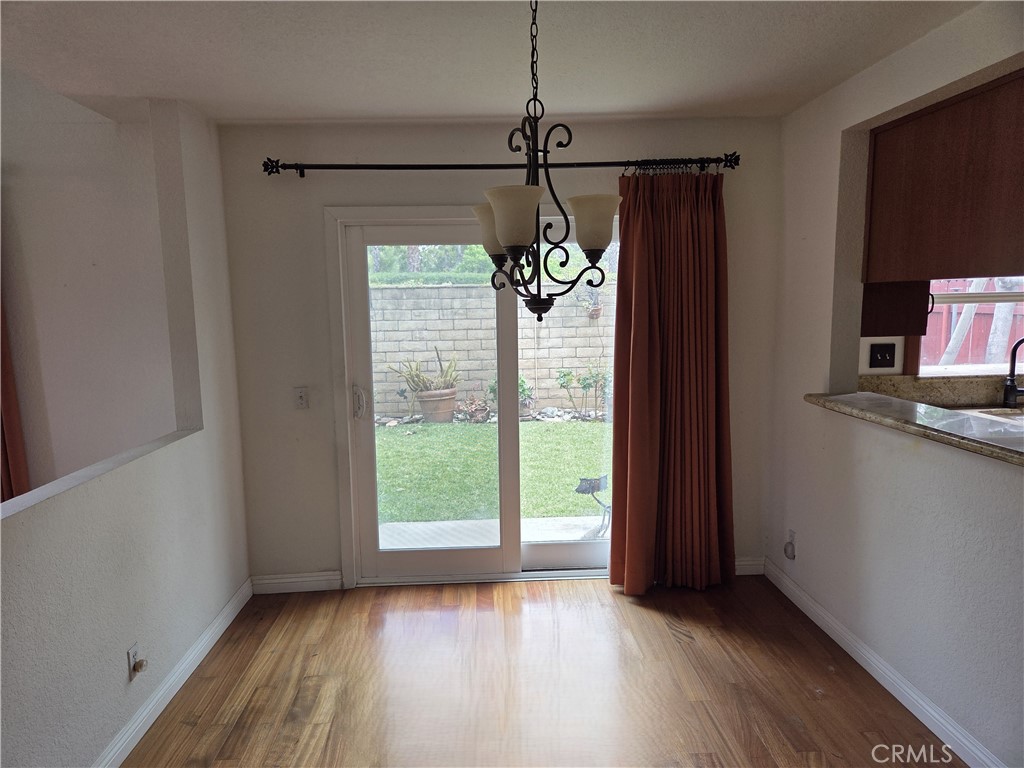 1330 Meadow Lane Duarte, CA 91010 - Photo 5 of 15 a view of an empty room with a window and wooden floor