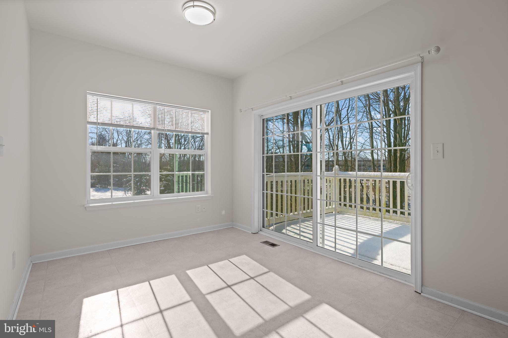 693 Jacobsen Circle, Unit 182 Newark, DE 19702 - Photo 10 of 40 Sliders off Kitchen to Rear Deck