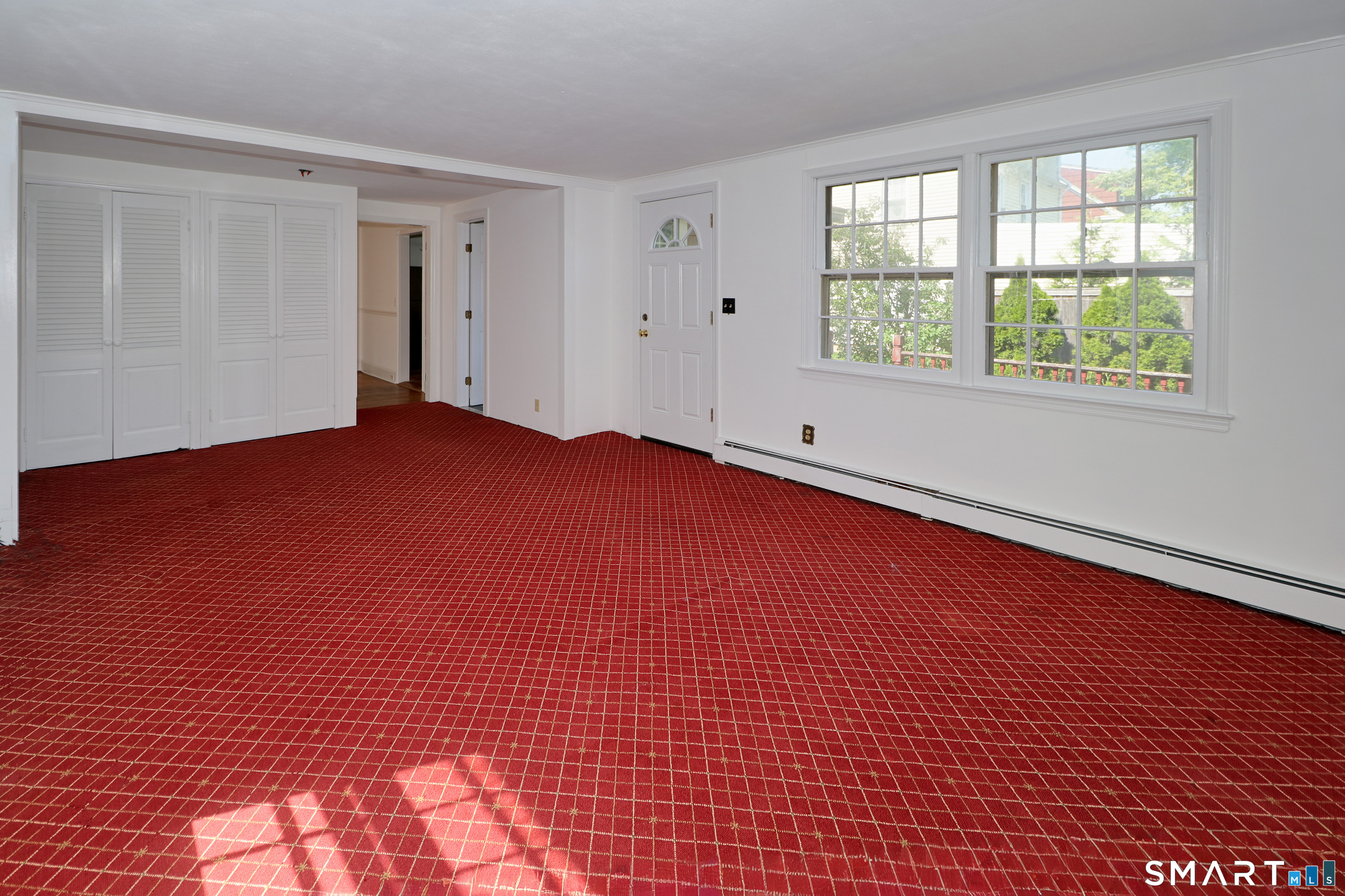 104 Henderson Road Fairfield, CT 06824 - Photo 11 of 26 Family Room with wall to wall carpet, large closet and full bath. It also has access to the large deck and backyard.
