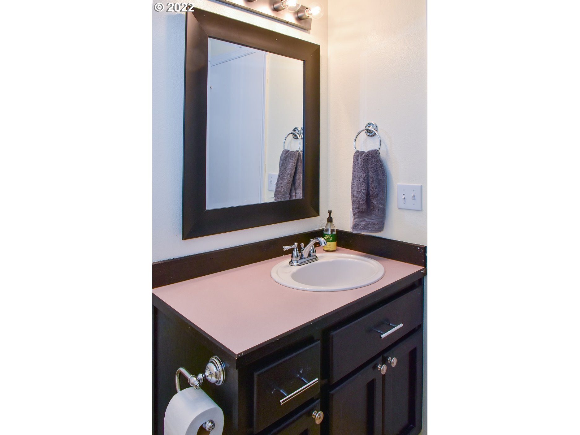 6806 D Court Springfield, OR 97478 - Photo 15 of 22 a bathroom with a sink and a mirror