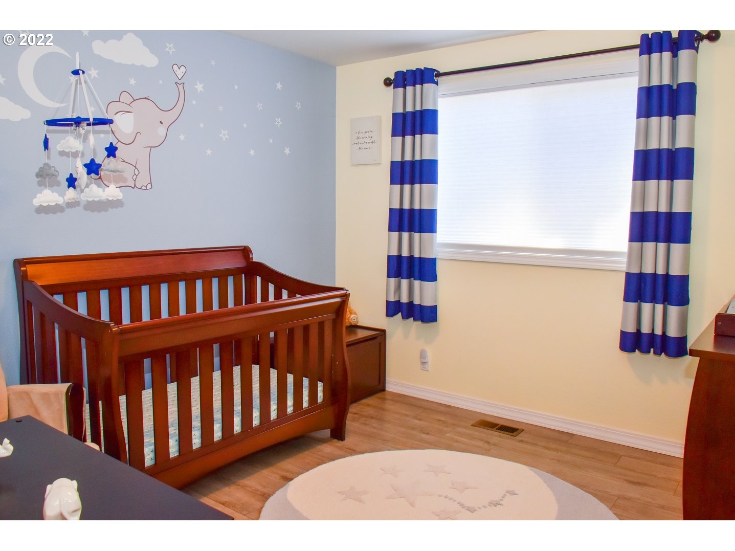 6806 D Court Springfield, OR 97478 - Photo 17 of 22 a bedroom with a bed and wooden floor