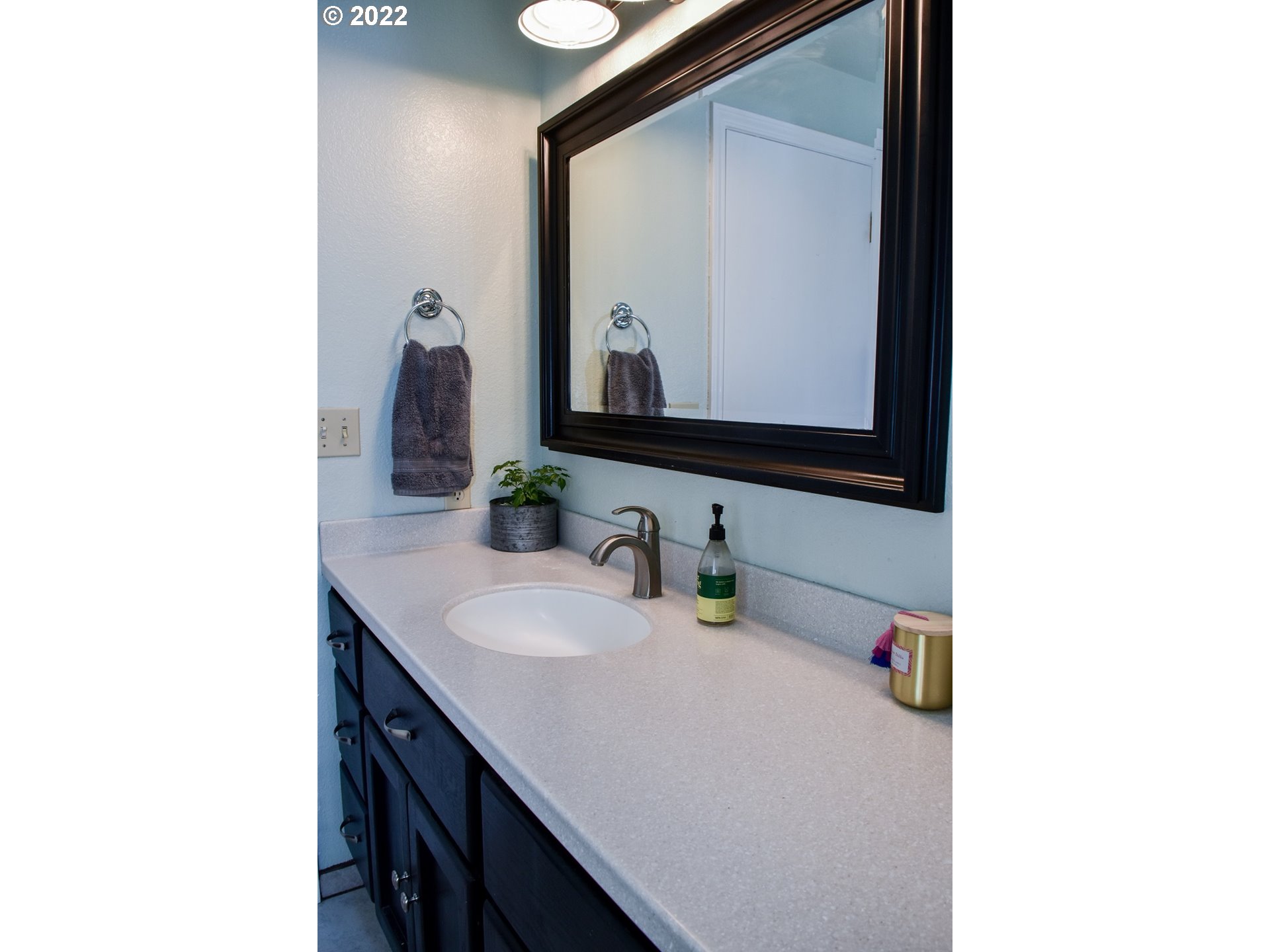 6806 D Court Springfield, OR 97478 - Photo 18 of 22 a bathroom with a sink and a mirror