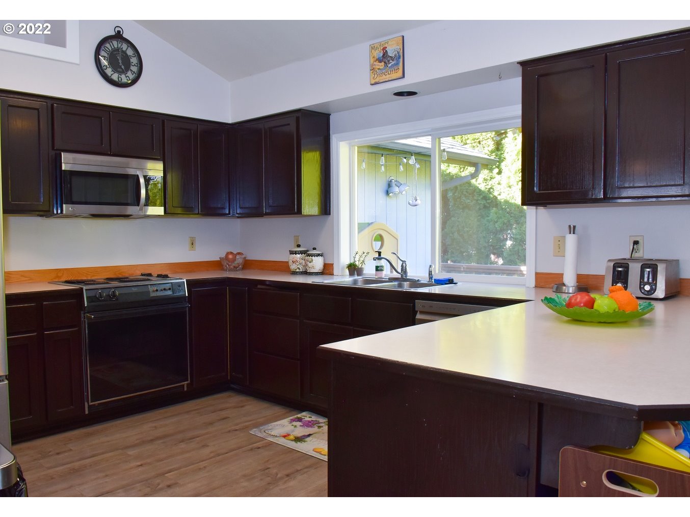 6806 D Court Springfield, OR 97478 - Photo 6 of 22 a kitchen with a sink cabinets and window