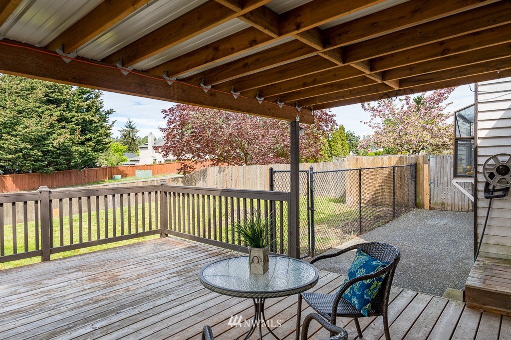 23110 13th Place West Bothell, WA 98021 - Photo 16 of 30 a patio with wooden floor a yard tables and chairs