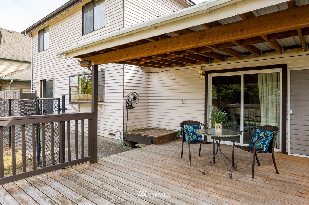 23110 13th Place West Bothell, WA 98021 - Photo 17 of 30 a view of a two chairs and table in the balcony