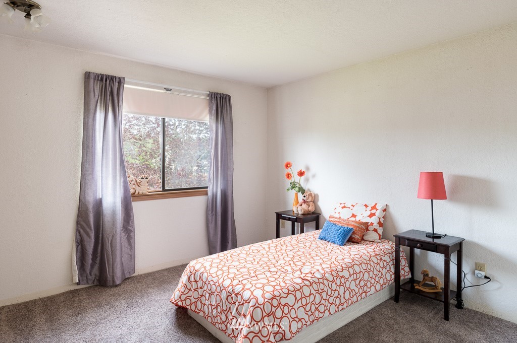 23110 13th Place West Bothell, WA 98021 - Photo 22 of 30 a bedroom with a bed and a window