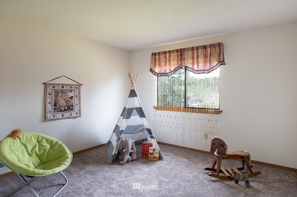 23110 13th Place West Bothell, WA 98021 - Photo 23 of 30 a living room with furniture and a window