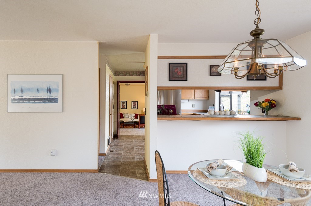 23110 13th Place West Bothell, WA 98021 - Photo 8 of 30 a dining room with furniture and chandelier