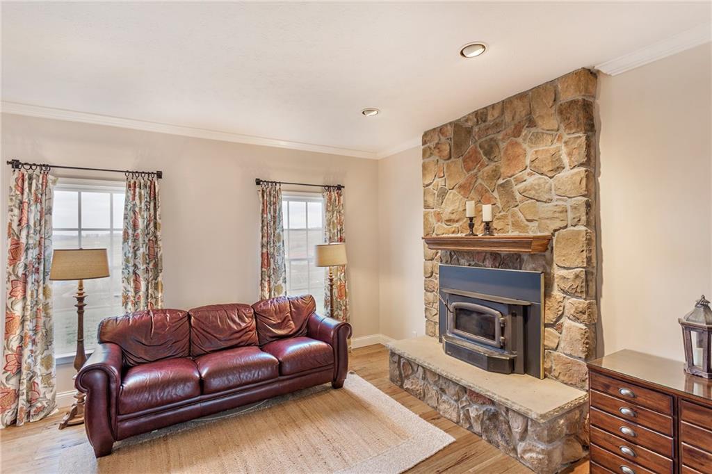 375 Lynn Portal Road Washington, PA 15301 - Photo 11 of 25 Living room with stone fireplace with wood-burning stove