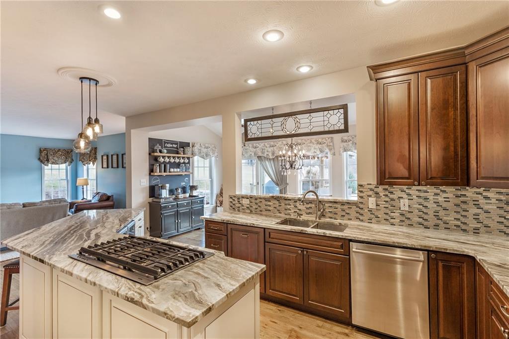 375 Lynn Portal Road Washington, PA 15301 - Photo 15 of 25 Attractive maple cabinets, quality granite countertops and glass tile backsplash