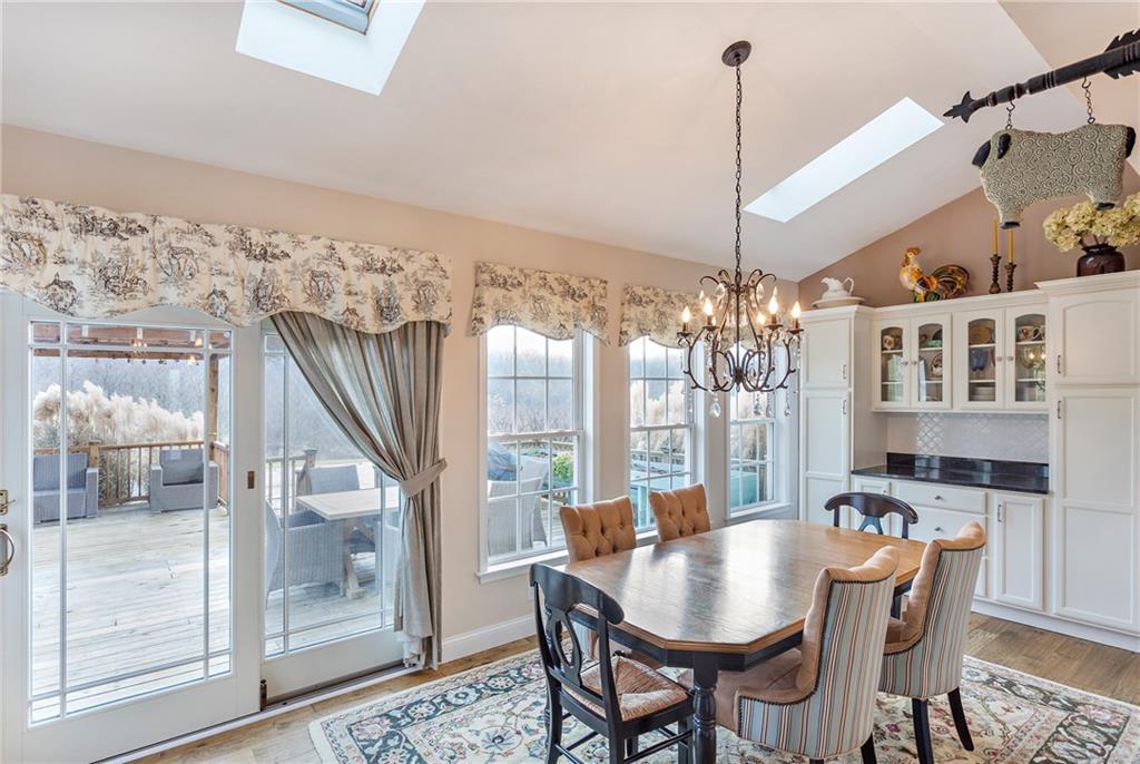 375 Lynn Portal Road Washington, PA 15301 - Photo 16 of 25 Sun-drench morning room with cathedral ceiling, wall of windows, deck access, built-ins & skylights