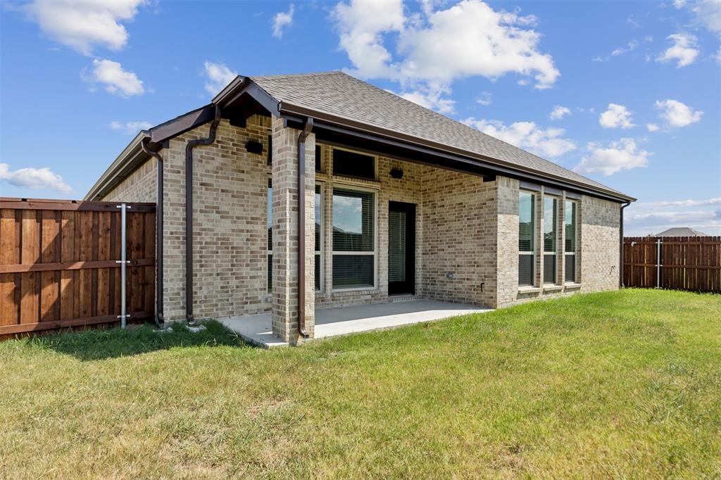 2540 Baypoint Drive Grand Prairie, TX 75054 - Photo 29 of 34 a front view of a house with garden