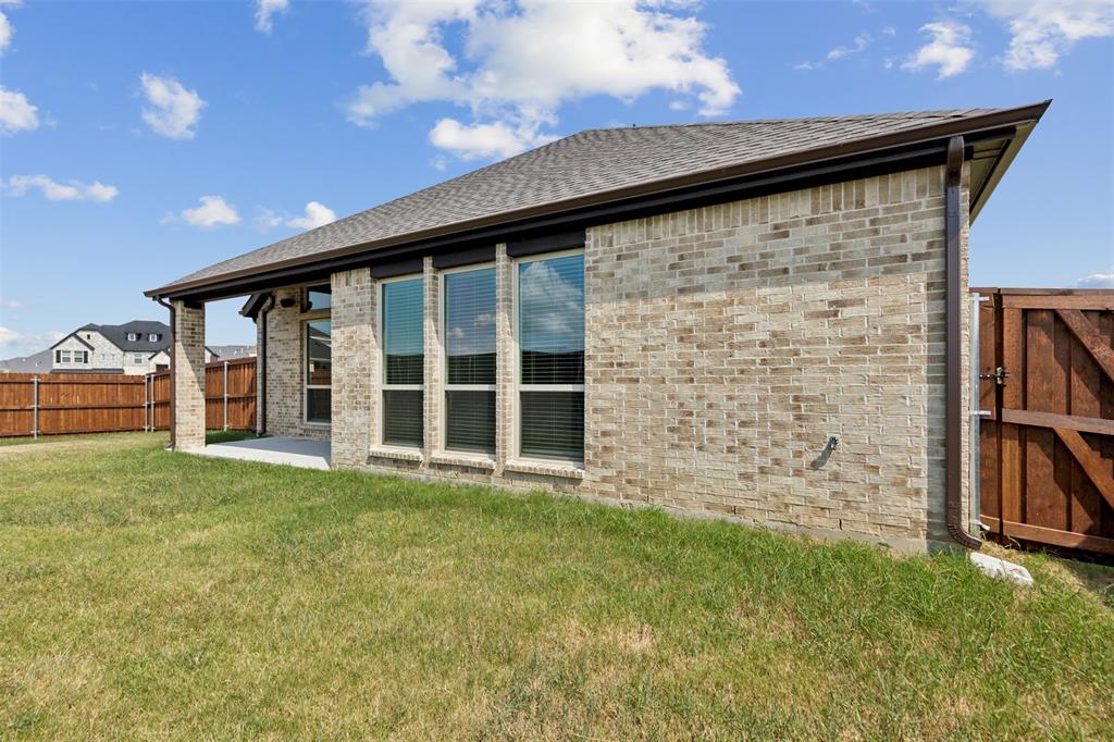 2540 Baypoint Drive Grand Prairie, TX 75054 - Photo 31 of 34 a view of a backyard with plants and large trees