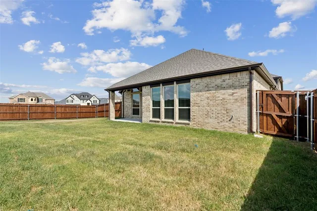 a view of a house with a garden